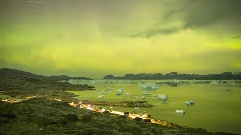 Timelapse of Northern Lights dancing over ice fjord of East Greenland Stock-Footage 332381571