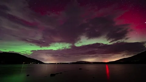 A timelapse of the Northern Lights shinning through clouds over Bassenthwai.. Stock Footage 289314929