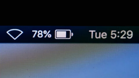 Timelapse of a notebook screen - battery and time running, 4k 스톡 동영상 130691172