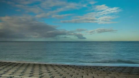 Timelapse of the ocean and a ship in the distance with cloud movement, 4k Stock Footage 179634719
