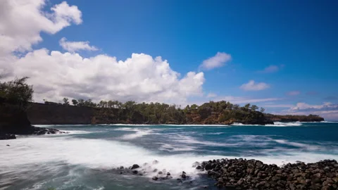 Timelapse - Ocean waves splashing the rocks with beautiful cloudscape above Stock Footage 234833414