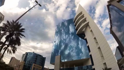 Timelapse of office building of the Bank in the background floating on the sky Stock Footage