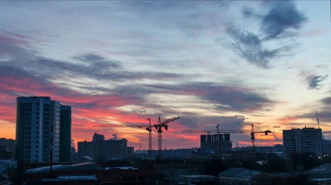 Timelapse operation of tower cranes in the winter frosty evening Stock Footage 52338987