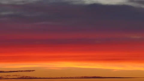 Timelapse Of Orange Sunset With Clouds Moving In The Sky. - wide shot Stockbeeldmateriaal 147644504