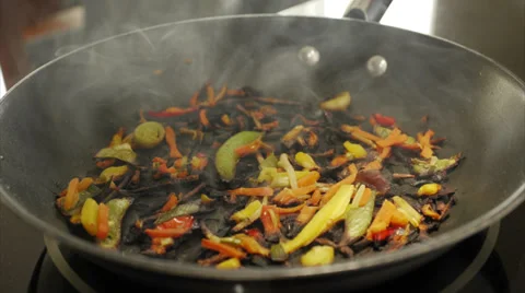 Timelapse over burning vegetables frying pan Stockbeeldmateriaal 36918700