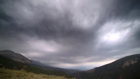 Timelapse over pine forest valley in Canada - Dramatic Clouds and Dark Weather Stock Footage 339821677