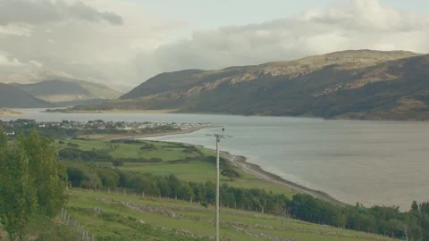 Timelapse overlooking Ullapool, Scotland, clouds and rainbow Stock Footage 342733730