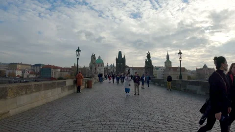 Timelapse of Overtourism: Crowds Flowing Across Charles Bridge in Prague Stock Footage 323822494