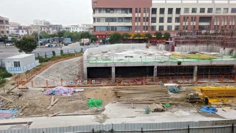 Timelapse pan view construction site building the second story in an afternoon Stock Footage 232487904