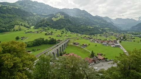 Timelapse panoramic view on viaduct train bridge, village and mountains. Typi Video stock 144452491