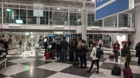 Timelapse of passengers in arirport at the gate Stock-Footage 73938346
