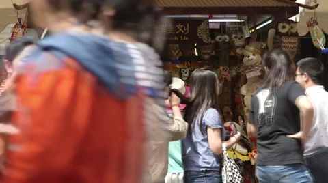 Timelapse of Passerbys viewing a street shop Stock Footage