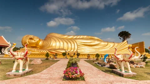Timelapse of passing cloud over gold reclining buddha Stock Footage 47239451