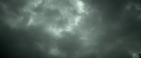 Timelapse of passing dark clouds after storm anamorphic Stock Footage 242870971