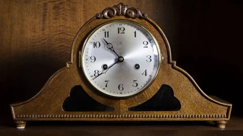Timelapse passing time on old vintage clock with hands running fast Stock Footage