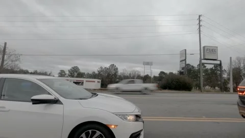 Timelapse of passing traffic between car view from street Stock Footage 149592609