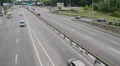 Timelapse of passing vehicles, cars driving city road daytime HD Footage