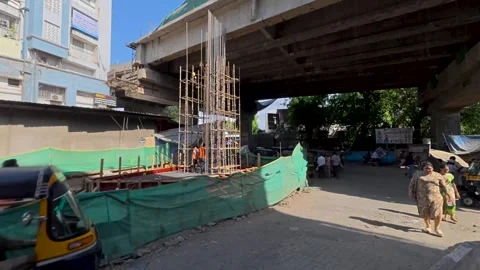 Timelapse people and auto rickshaws moving under a concrete bridge Stock Footage 337458428