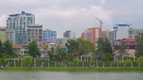 Timelapse: people are walking fast along the shore of lake in Batumi Stock Footage 340429906
