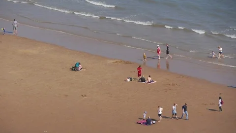 Timelapse of people on beach Stock Footage 74449344