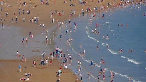 Timelapse of people on beach Stock Footage 74449479