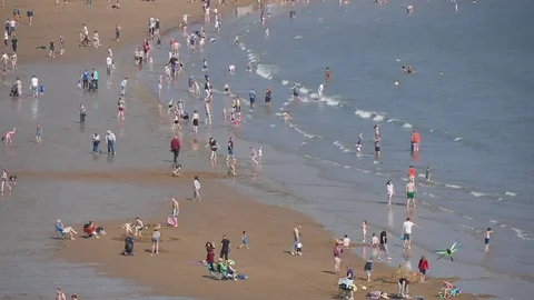 Timelapse of people on beach Stock Footage 74449606