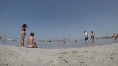 Timelapse people at the beach Stock Footage 128349608