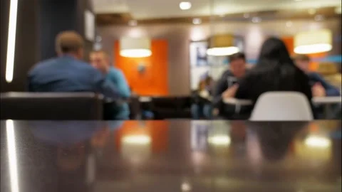 Timelapse people in defocus sit and eat in fast food restaurant Stock Footage 134800668