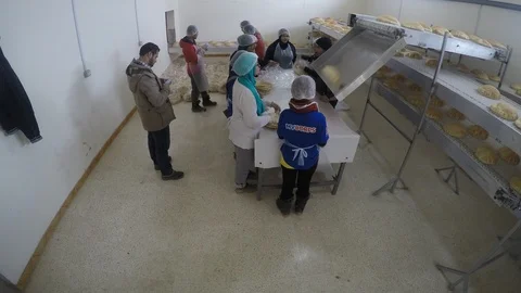 Timelapse of people doing work at  bread factory in Lebanon Stock Footage 100857574