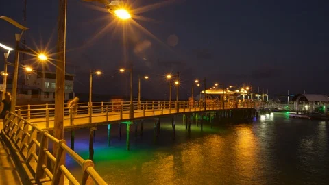 Timelapse people on jetty at night Stock Footage 108715740