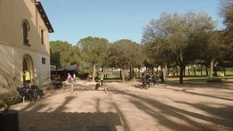 Timelapse-People in a park, doing jog, running, riding bike,  walking, relaxing Stock Footage 88285564