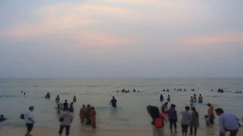 Timelapse of people playing on the beach post sunset Stock Footage 78020619