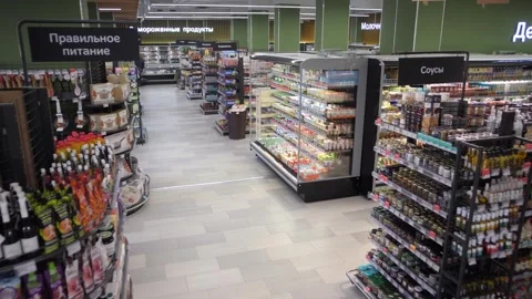 Timelapse of people with shopping carts moving in a supermarket Stock Footage 247470148
