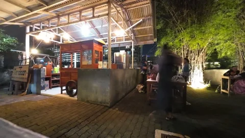 Timelapse of people in a small stall Stock Footage 233662606
