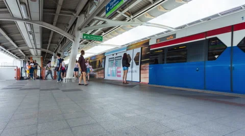 Timelapse People standing in lines waiting for BTS sky train in Bangkok Thailand Stock Footage