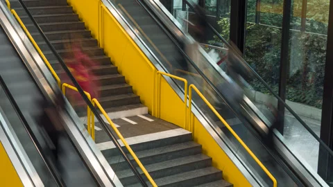 Timelapse of people using a yellow escalator Stock Footage 249391012