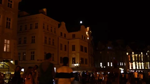 Timelapse of people walking up and down the square in the old night town Stock Footage 132255804