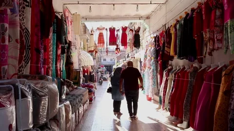 Timelapse Of people Walking In An old Popular Alley Filled With Clothes Shops Stock Footage