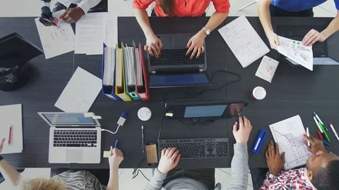 Timelapse of people working efficiently in a contemporary workplace 動画素材 76451229