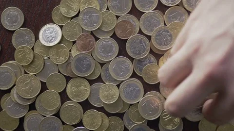 Timelapse of picking coins and putting to savings Stockbeeldmateriaal 75549446