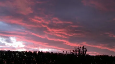 Timelapse of pink clouds turning to stormy grey Video stock 7767093