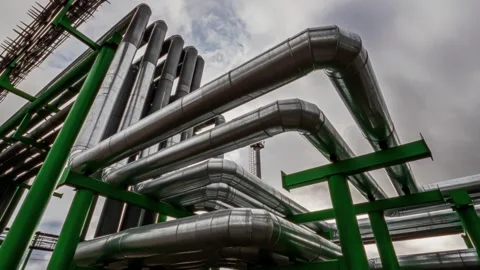 Timelapse of Pipelines made of shiny stainless steel through which oil and gas f Stock Footage 252216519