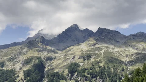 Timelapse of Piz Ferre mountain - Moving clouds and shadows in Italian Alps Stock Footage 328403247