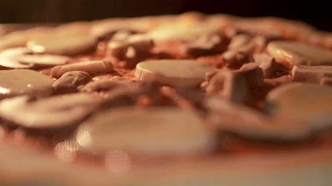 Timelapse of a pizza being cooked in the oven. Close-up melting cheese in 4K. Stock Footage 137482216