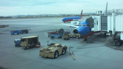 Timelapse of planes pulling into terminals at las vegas airport Stock Footage 38730756