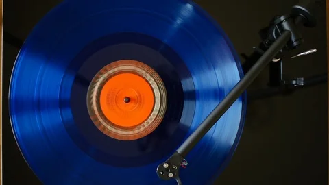 Timelapse of playing blue long play record Stock Footage 123697405