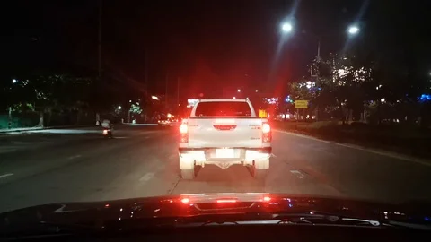 Timelapse point of view of traffic and neon lights on the streets at night Stock Footage 95135639
