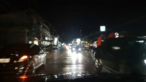 Timelapse point of view of traffic and neon lights on the streets at night Stock Footage 95213581