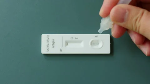 Timelapse of positive result of rapid antigen test kit (ATK) for self test Stock Footage 196903793