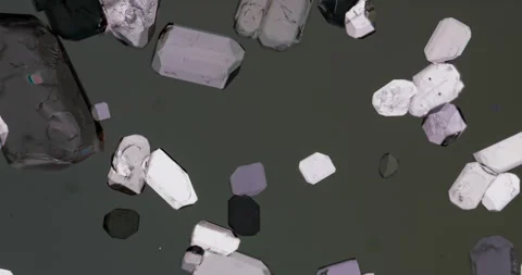 Timelapse of Potassium hydrogen tartrate crystallization under polarized light Stock Footage 116873231